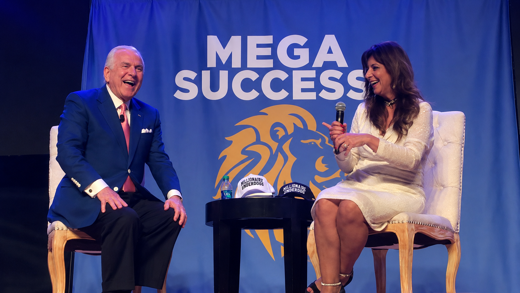Sharing a laugh on stage at the Mega Success conference